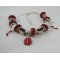 Zilveren armband met rode lieveheersbeestje kralen