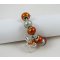 Zilveren armband met oranje kralen en strik