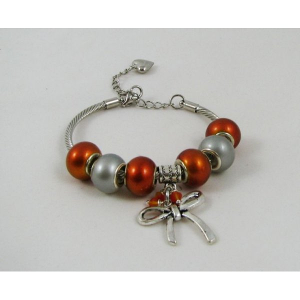 Zilveren armband met oranje kralen en strik