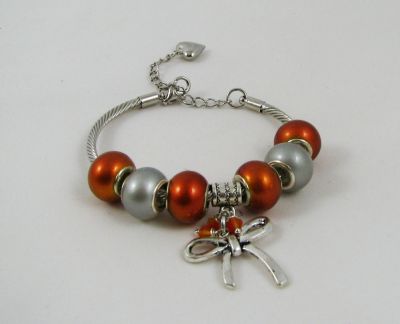 Zilveren armband met oranje kralen en strik