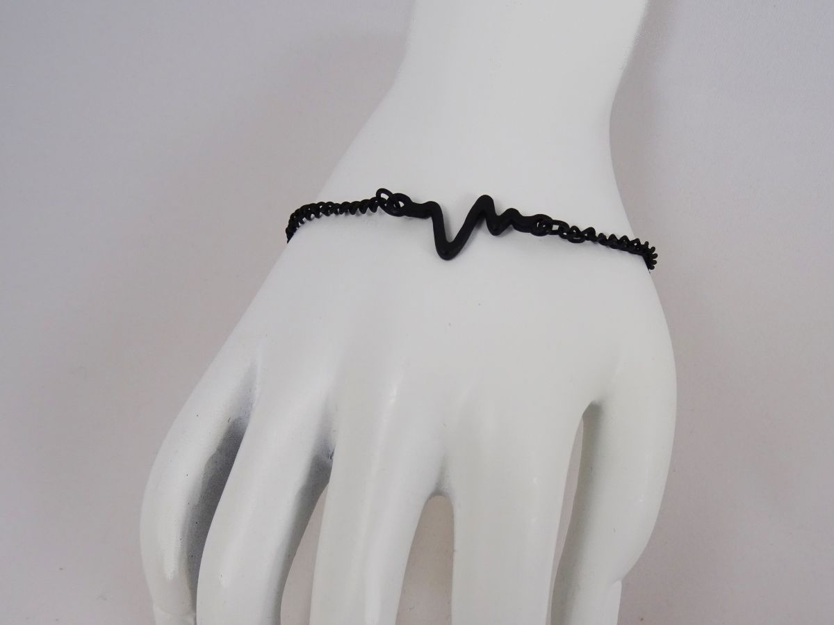 Dunne zwarte armband ontwerp Golven