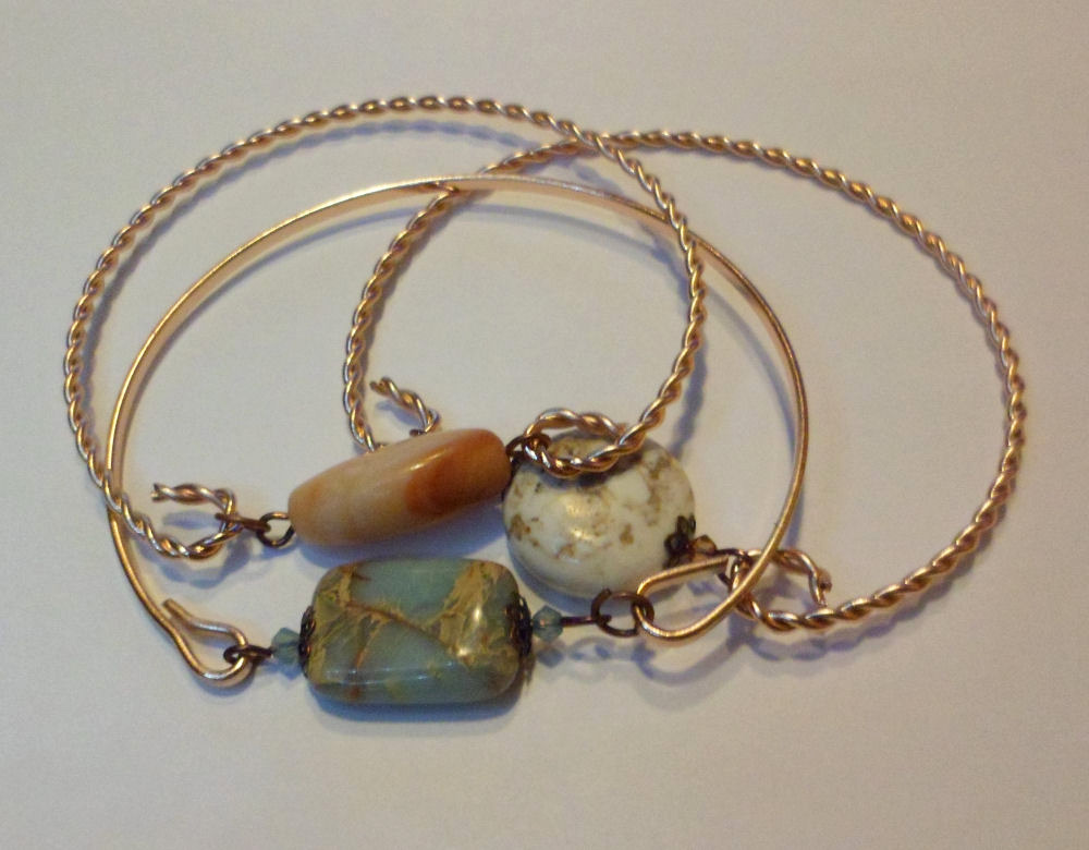 Bracelet jonc torsadé coloris or rose