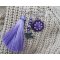 Paarse vriendschapsbroche met pompon 