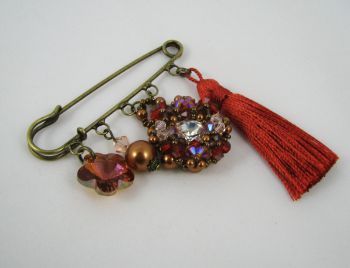 Andros Hyacint Broche met Paprika Pompon