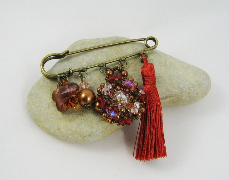 Andros Hyacint Broche met Paprika Pompon