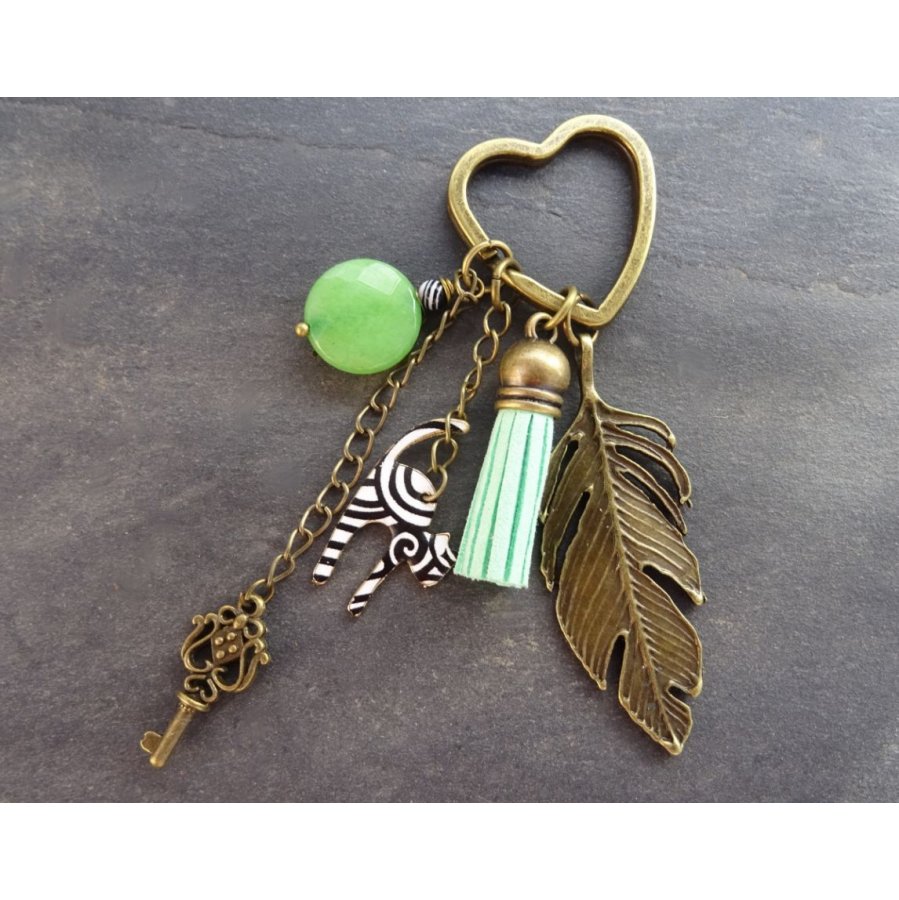 Zwart-witte kattensleutelhanger met groene pompon