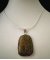 Cabochon hanger gezet in unakiet steen ronde rechthoekige vorm