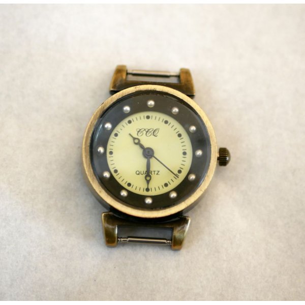 Zwarte en bronzen wijzerplaat