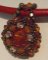 Milos Oranje boom hanger op rood leer