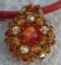 Milos Oranje boom hanger op rood leer