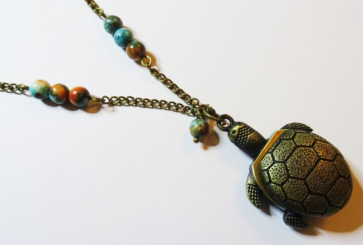 Lange hanger schildpad met parels 