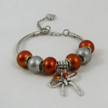 Zilveren armband met oranje kralen en strik