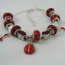 Zilveren armband met rode lieveheersbeestje kralen